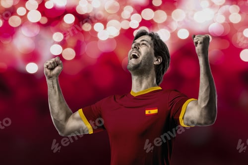 Preview: Spanish Soccer Player, Celebrating On A Red Lights Background.