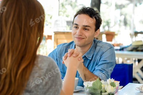 Preview: Happy Couple Enjoying Breakfast In A Cafe. Love And Lifestyle Concept.