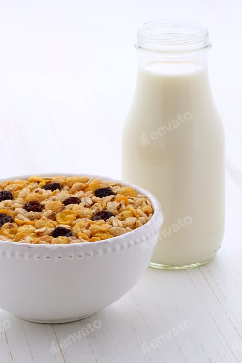 Preview: Delicious And Nutritious Breakfast Muesli Or Granola Cereal With Milk On Vintage Styling.