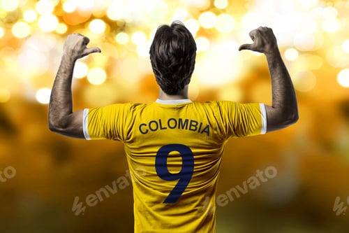Preview: Colombian Soccer Player, Celebrating On A Yellow Lights Background.