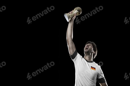 Preview: German Soccer Player, Celebrating The Championship With A Trophy In His Hand. On A Black Background.