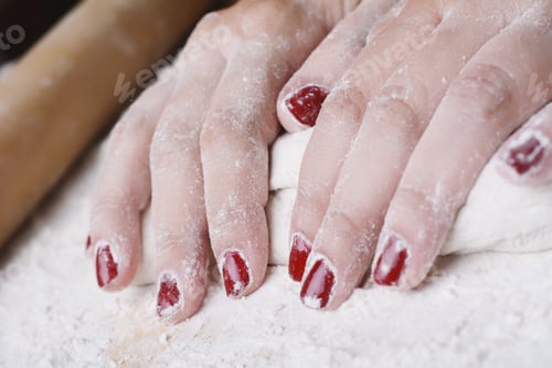 Preview: Close-Up Of Woman Hands Kneading Dough On Wooden Table. Cooking And Baking Concept.