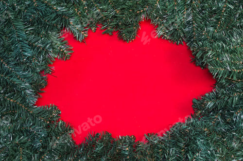 Preview: Texture With Christmas Theme With Green Leaves, Decorative Objects And Red Background. With Copy