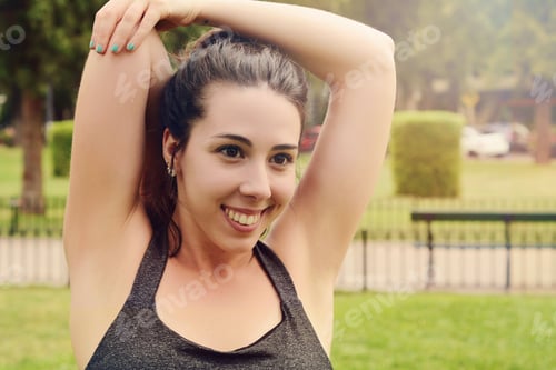 Preview: Portrair Of Young Beautiful Woman Doing Exercise At Park. Sport Concept. Outdoors