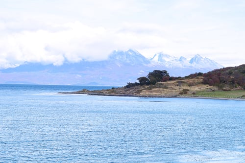 Preview: View Of A River With Mountains At The Back.