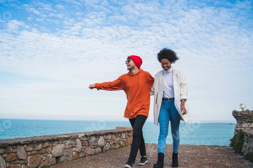 Preview: Portrait Of Two Young Friends Spending Some Nice Time Together, Walking On Coast Line And Having