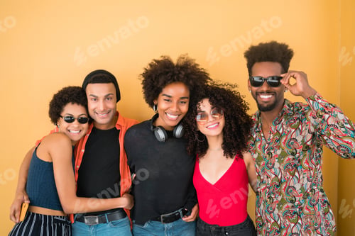 Preview: Portrait Of Afro Friends Having Fun Together And Enjoying Good Time Against Yellow Background