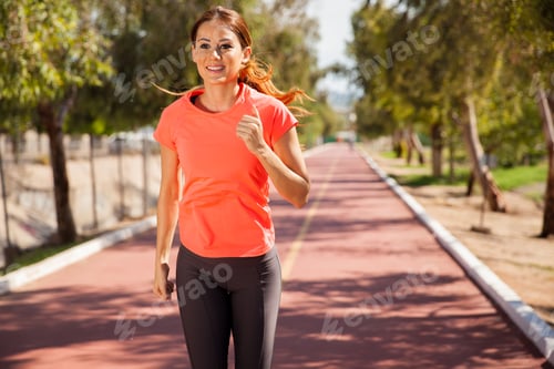Preview: Pretty Young Brunette Working Out And Running Outdoors On A Sunny Day