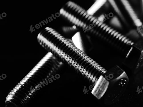 Preview: A Studio Grayscale Of Screws On Black Background