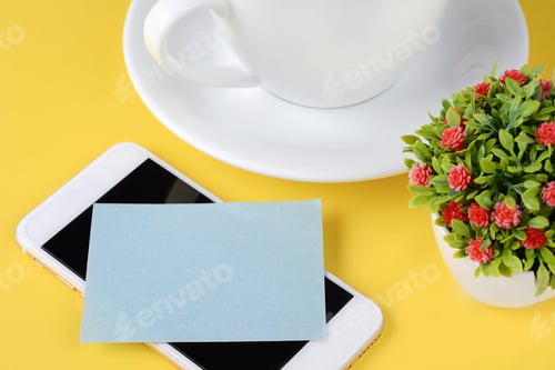 Preview: Empty Paper Card With Cup Of Coffee And Phone On A Yellow Background.