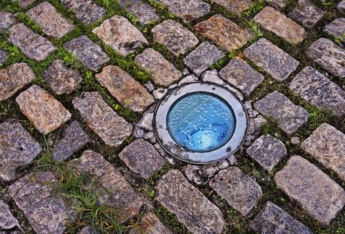 Cobblestone Pavers with Circular Blue Glass Light