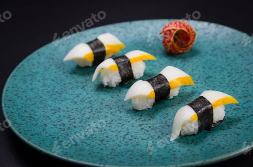 Preview: Sushi, Traditional Japanese Cuisine. Delicious Hadock Tako Sushi On Decorated Plate, Black