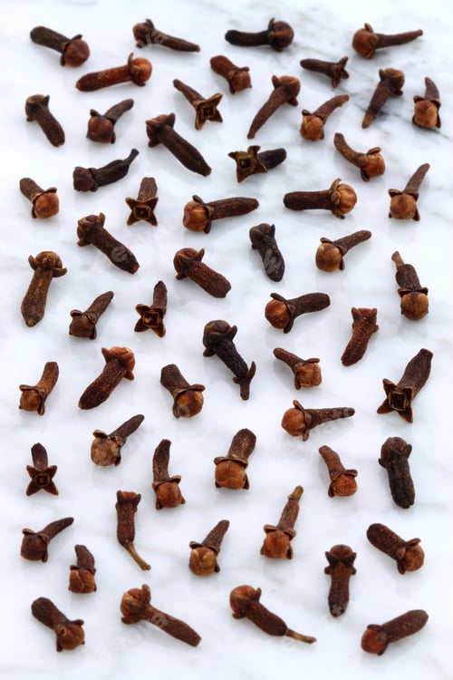 Preview: Beautiful Cloves, Aromatic Flower-Buds, On Carrara Marble Countertop.