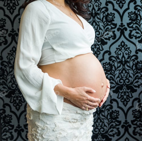Preview: Pregnancy, Rest, People And Expectation Concept - Happy Pregnant Woman Sitting On Bed And Touching