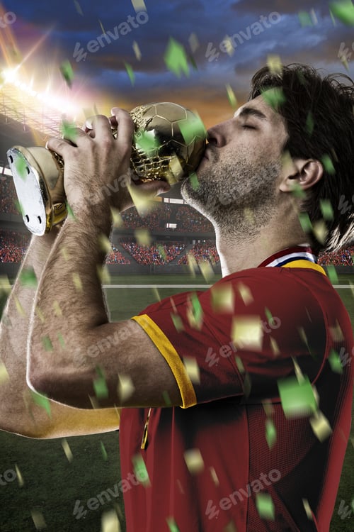 Preview: Spanish Soccer Player, Celebrating The Championship With A Trophy In His Hand. On A Stadium.