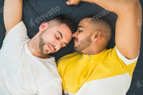 Preview: Portrait Of A Happy Gay Couple Spending Time And Laying Down On The Floor. Lgbt And Love Concept.