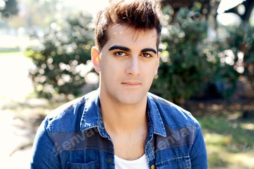Preview: Portrait Of A Young Asian Man. Outdoors. Urban Concept.