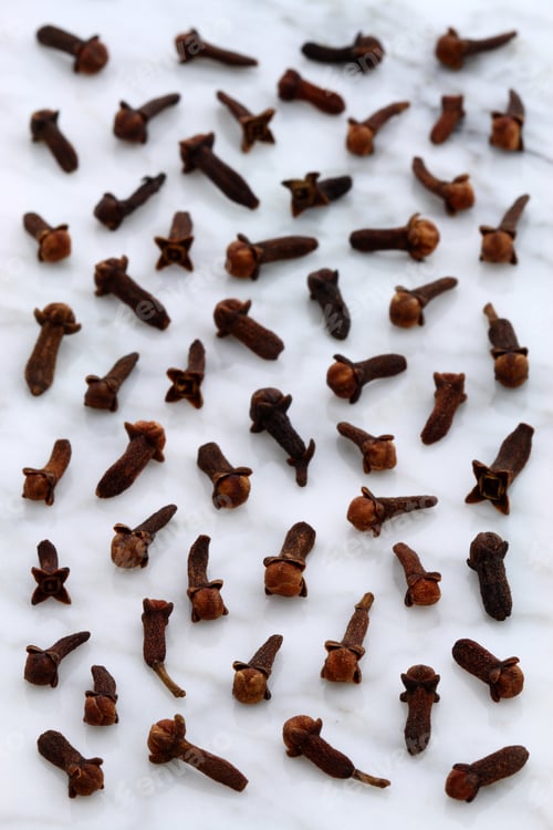 Preview: Beautiful Cloves, Aromatic Flower-Buds, On Carrara Marble Countertop.