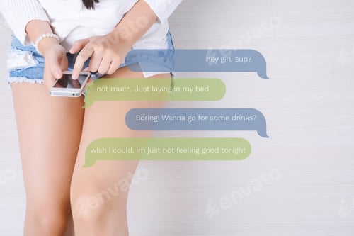 Preview: Beautiful Young Woman Using Her Smartphone And Relaxed. Indoors.