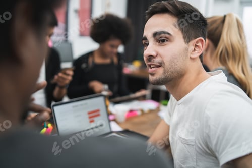 Preview: Young Creative Designers Working In A Project And Discussing New Order Development On Workplace
