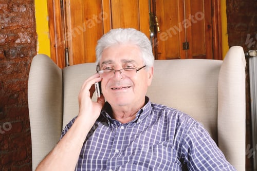 Preview: Senior Man Relaxes While Talking on Phone