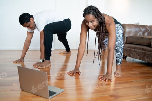 Preview: Couple Doing Exercise Together At Home.