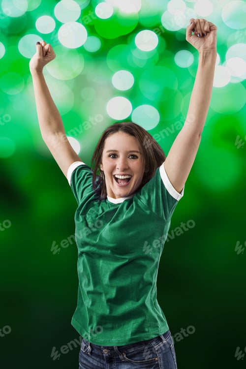 Aperçu: Female Mexican Fan Celebrating On A Green Lights Background.