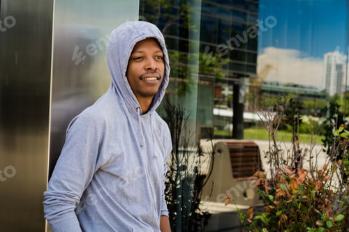 Preview: Portrait Of Young African American Man In Hooded Sweatshirt Outdoor.