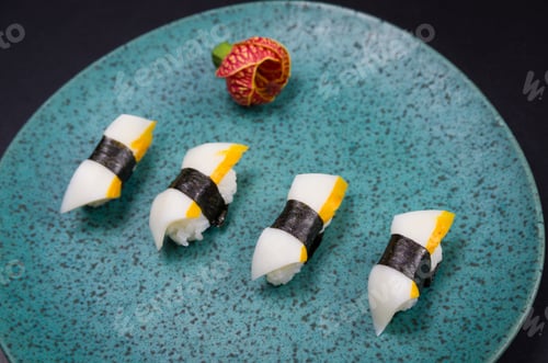 Preview: Sushi, Traditional Japanese Cuisine. Delicious Hadock Tako Sushi On Decorated Plate, Black