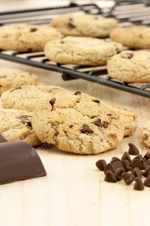 Preview: Fresh Baked Stack Of Warm Chocolate Chips Cookies On Cooling Rack Shallow Dof