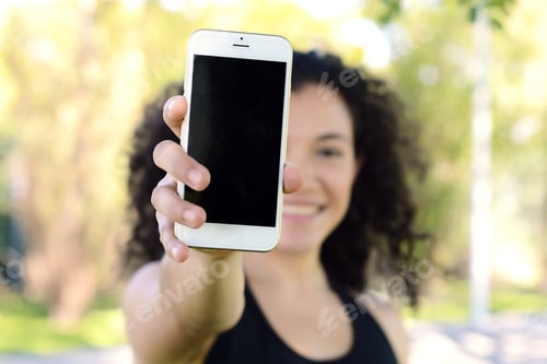 Preview: Close Up Of Young Women Showing Smartphone With Black Screen In The Park.