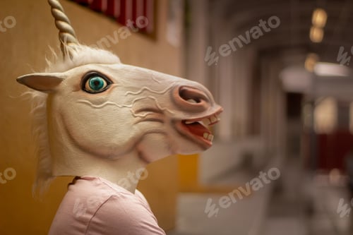 Preview: Photograph Of A Teen With A Funny Unicorn Mask