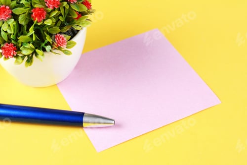 Preview: Empty Paper Card With Pen On A Yellow Background.