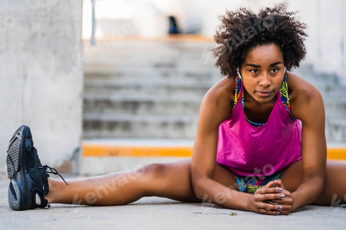 Preview: Afro Athlete Woman Stretching Legs Before Exercise.