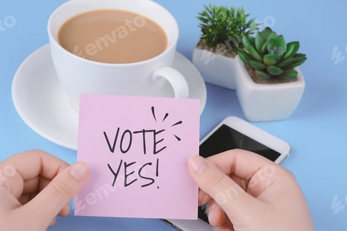 Preview: Paper Card With Tect "Vote Yes!" And Phone On A Light Blue Background.