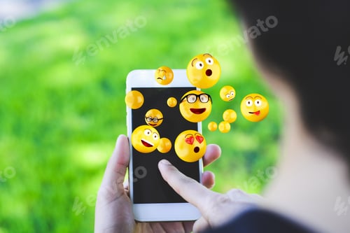 Preview: Close-Up Of Woman Using Smartphone Sending Emojis. Social Concept.
