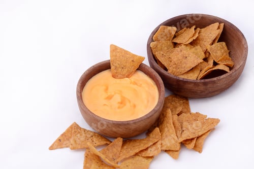 Preview: Close Up Of Nachos With Cheese Dip. Unhealthy Food Concept. Isolated White Background