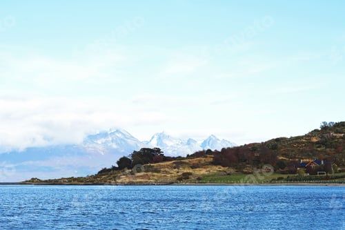 Preview: View Of A River With Mountains At The Back.