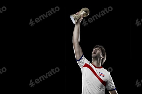 Preview: Costa Rican Soccer Player, Celebrating The Championship With A Trophy In His Hand. On A Black