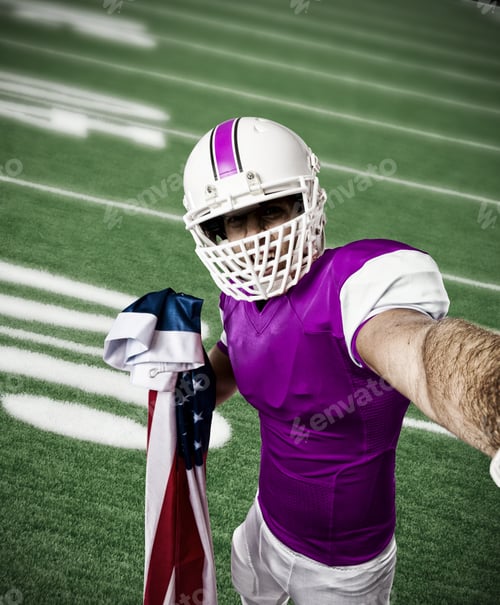 Preview: Football Player With A Pink Uniform Making A Selfie On A Football Field.