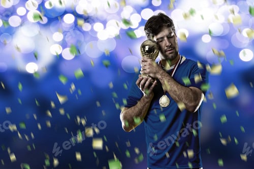 Preview: French Soccer Player, Celebrating The Championship With A Trophy In His Hand. On A Blue Lights