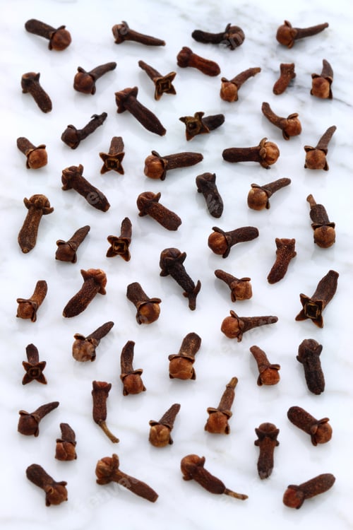 Preview: Beautiful Cloves, Aromatic Flower-Buds, On Carrara Marble Countertop.
