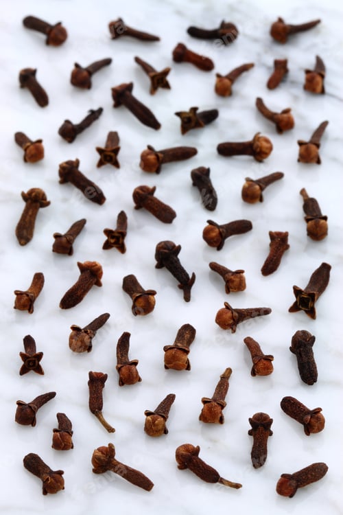 Preview: Beautiful Cloves, Aromatic Flower-Buds, On Carrara Marble Countertop.