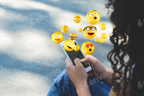 Preview: Close-Up Of Woman Using Smartphone Sending Emojis. Social Concept.