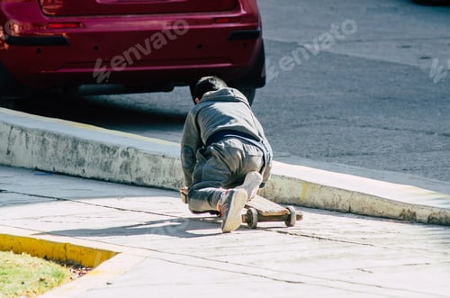 Preview: Child Playing On The Street With An Artisan Skateboard On A Sunny Day