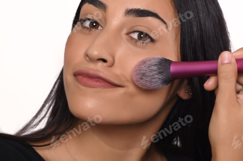 Preview: Young Beautiful Woman Applying Make Up. Isolated White Background.