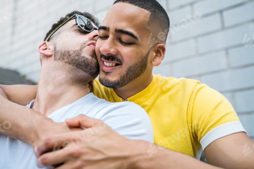 Preview: Portrait Of Happy Gay Couple Spending Time Together While Sitting On Stairs Outdoors. Lgbt And Love