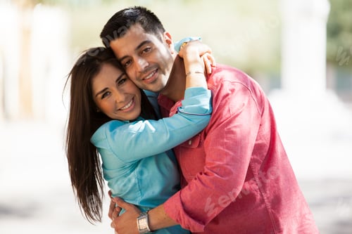 Preview: Cute Young Hispanic Couple Hugging Each Other While Spending Time Together Outdoors