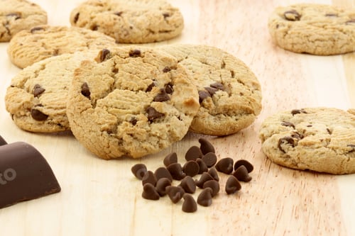 Preview: Fresh Baked Stack Of Chocolate Chips Cookies On Wood Station Shallow Dof