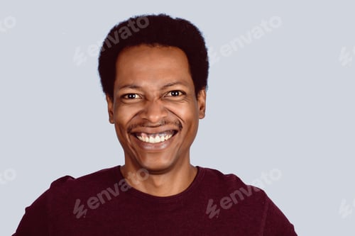 Preview: Portrait Of Afro American Man Looking At Camera On Studio.